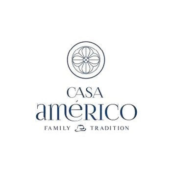 The Casa Américo 2023 Sonante DOP Dão Tinto label features a circular floral emblem above the Casa Américo name, with "Family" and "Tradition" divided by a hat icon below—all in a refined serif font.